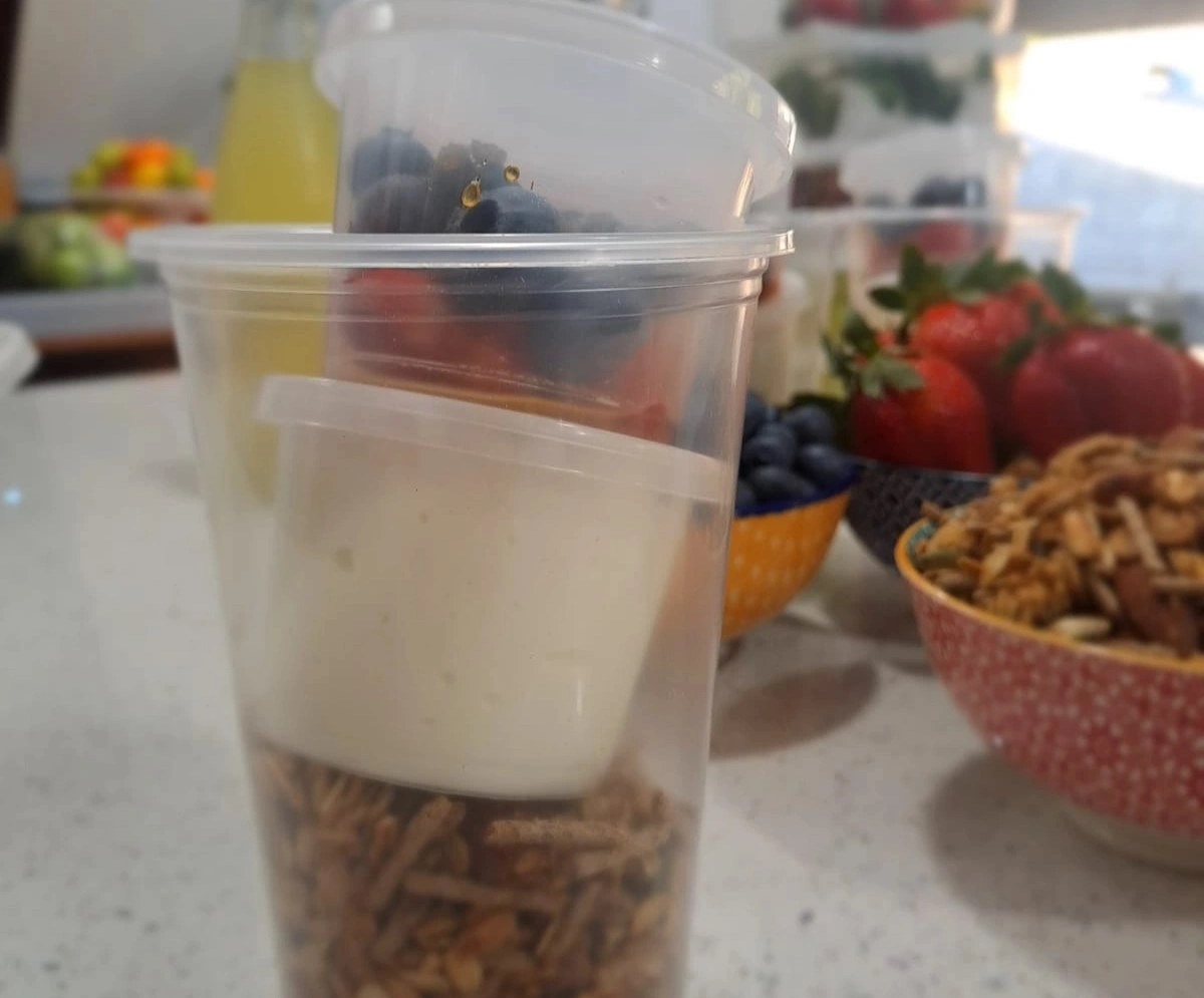 Oven baked muesli, served with plain yogurt and fresh fruit